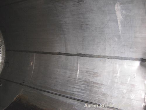 Used Tank, 5,000 Gallon, 304 Stainless Steel, Vertical. Approximate 102" diameter x 144" straight side. Dish top and bottom. Side bottom agitator, 3 blade prop, driven by a 5 HP, 3/60/230/460 Volt, 1...