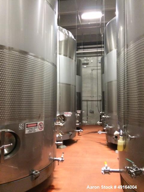 Used Paul Mueller 12,000 Gallon, White Wine Fermenting Tank, Stainless Steel, Vertical. Model DF, Slope top and bottom. 140 “ O.D. x 208-1/4” high. (2) Bands of dimple jacket on sides rated at 200 ps...