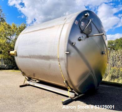 Used- Paul Mueller 6000 Gallon Stainless Steel Vertical Storage Tank. Overall Dimensions are approx. 11W x 11L x 14H. Multip...