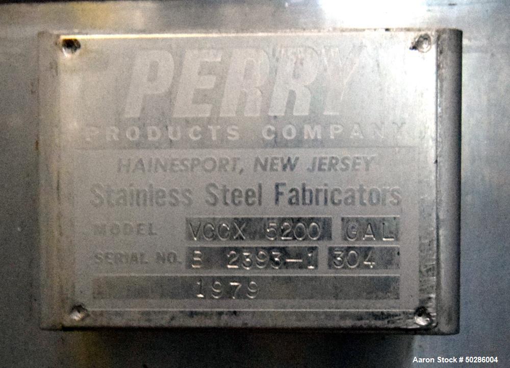 Used Perry Products Tank, 5,200 Gallon, Model VCCX, 304 Stainless Steel, Vertical. Approximate 106" diameter x 132" straight side, coned top & bottom. (1) Spray nozzle. Openings top (2) 2", 3", 4", 1...