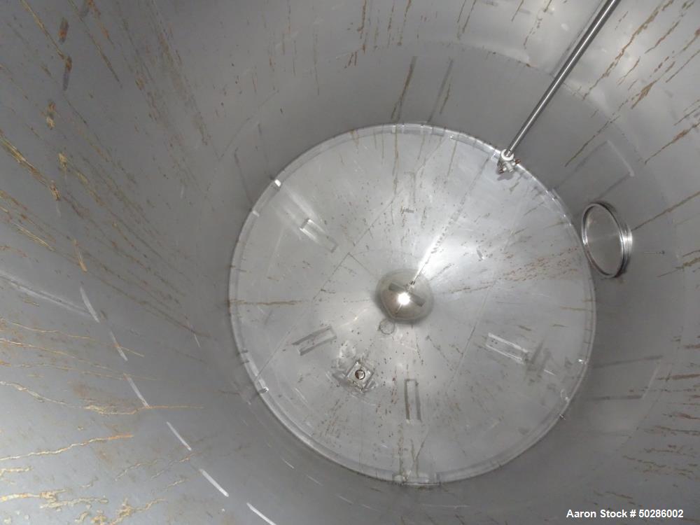 Used Perry Products Tank, 5,200 Gallon, Model VCWX, 304 Stainless Steel, Vertical. Approximate 106" diameter x 132" straight side, coned top & bottom. (1) Spray nozzle. Openings top 2", 3", (2) 4", 1...