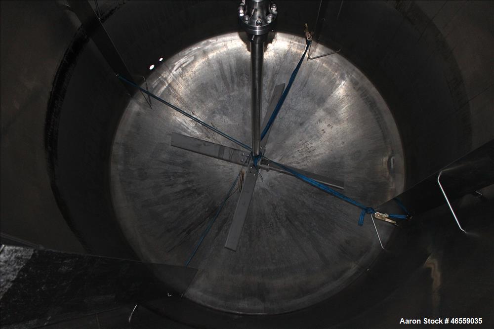 Used Precision Stainless Mixing Tank, 12,000 Gallon, 316L Stainless Steel, Vertical. Approximate 144" diameter x 166" straight side. Dished top and bottom heads. Insulated. 304L Stainless steel dimpl...