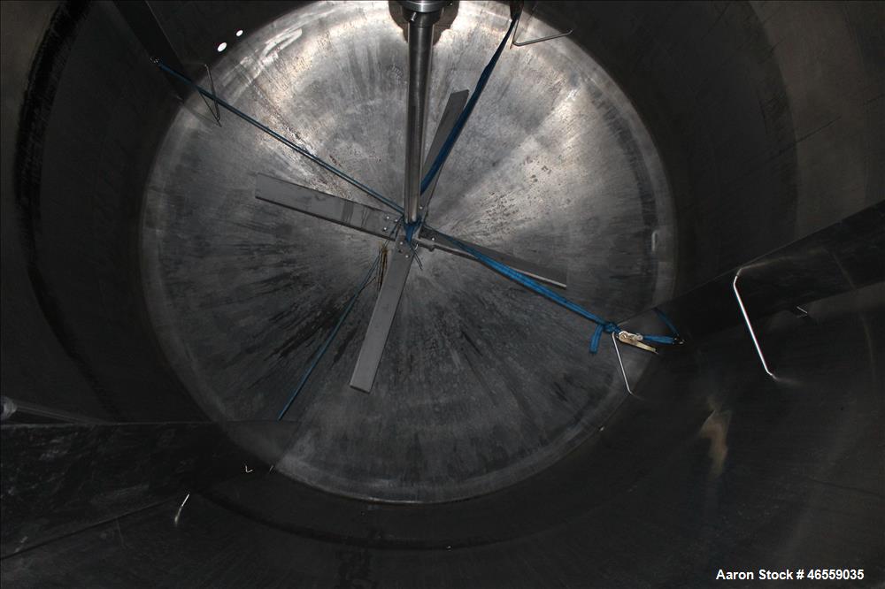 Used Precision Stainless Mixing Tank, 12,000 Gallon, 316L Stainless Steel, Vertical. Approximate 144" diameter x 166" straight side. Dished top and bottom heads. Insulated. 304L Stainless steel dimpl...