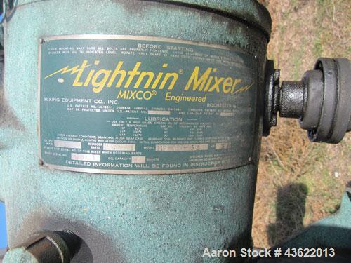 Used Saracco Tank & Mfg Approximately 5,200 Gallon Stainless Steel Storage Tank. Approximately 9' diameter x 11' straight side. Flat bottom and slight cone top. Various top openings including a 17" m...