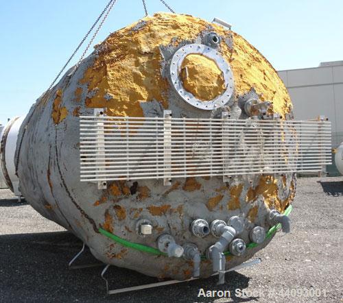 Used Stainless Metals Inc Tank, 8800 Gallon, 304L Stainless Steel, Vertical. Approximate 120" diameter x 180" straight side, dished top, flat bottom. Openings top (12) 3", 24" man way with cover, sid...