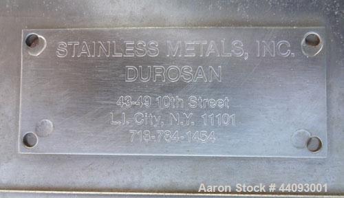 Used Stainless Metals Inc Tank, 8800 Gallon, 304L Stainless Steel, Vertical. Approximate 120" diameter x 180" straight side, dished top, flat bottom. Openings top (12) 3", 24" man way with cover, sid...