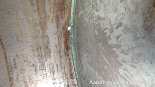 Used Stainless Metals Inc Tank, 8800 Gallon, 304L Stainless Steel, Vertical. Approximate 120" diameter x 180" straight side, dished top, flat bottom. Openings top (12) 3", 24" man way with cover, sid...