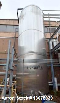 Used Single Wall 17,000 Gallon Stainless Steel Tank, Vertical. Single wall. Side bottom outlet. Last used as waste water tank.