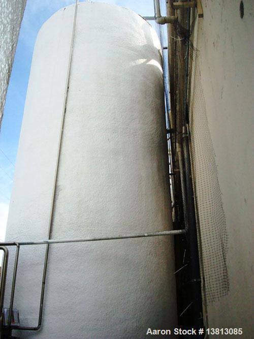 Used Valley Foundry 13,000 Gallon Vertical Stainless Insulated Tank. Vertical flat bottom tank with spray-on insulation and sightglass. Bottom front 3" outlet. Bottom side manway. 10'2" External diam...