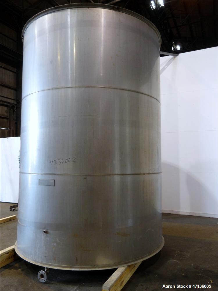 Used Valley Foundry & Machine Works Tank, Approximate 5,000 Gallon, 304 Stainless Steel, Vertical. Approximately 102" diameter x 143" straight side, slight cone top, sloped bottom. Top openings: 24" ...