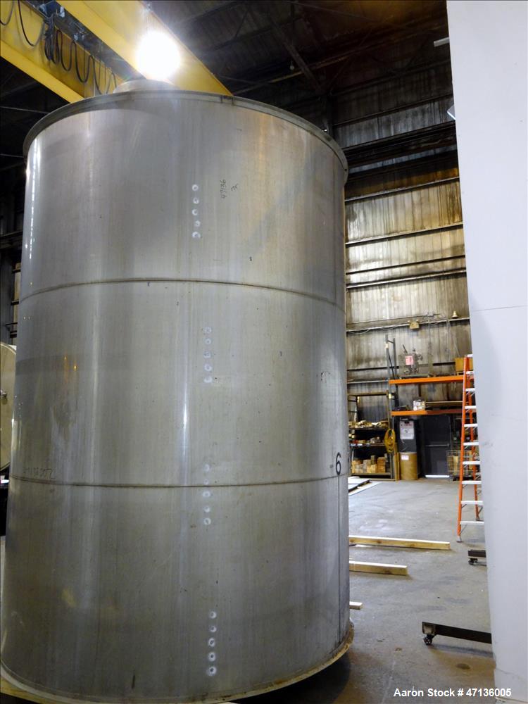 Used Valley Foundry & Machine Works Tank, Approximate 5,000 Gallon, 304 Stainless Steel, Vertical. Approximately 102" diameter x 143" straight side, slight cone top, sloped bottom. Top openings: 24" ...