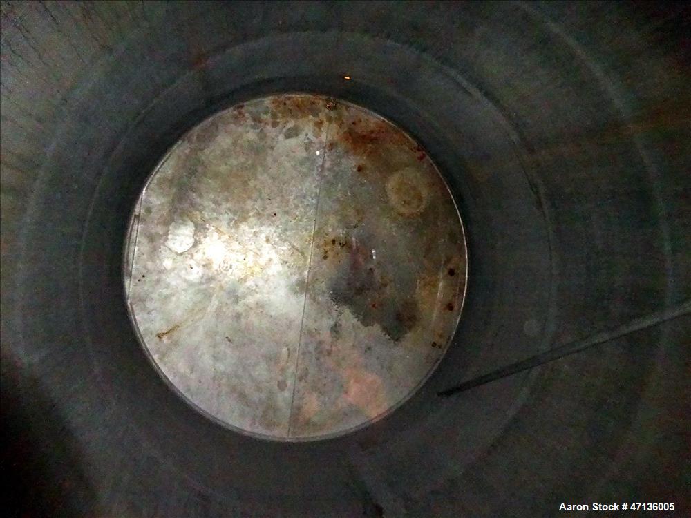 Used Valley Foundry & Machine Works Tank, Approximate 5,000 Gallon, 304 Stainless Steel, Vertical. Approximately 102" diameter x 143" straight side, slight cone top, sloped bottom. Top openings: 24" ...