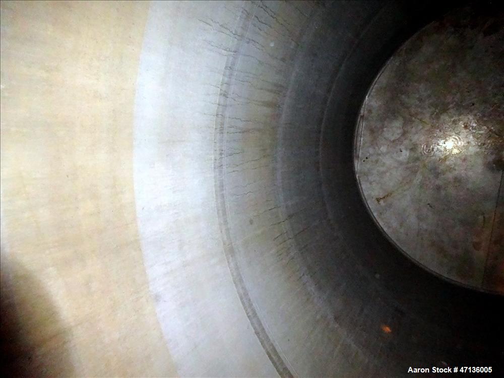 Used Valley Foundry & Machine Works Tank, Approximate 5,000 Gallon, 304 Stainless Steel, Vertical. Approximately 102" diameter x 143" straight side, slight cone top, sloped bottom. Top openings: 24" ...