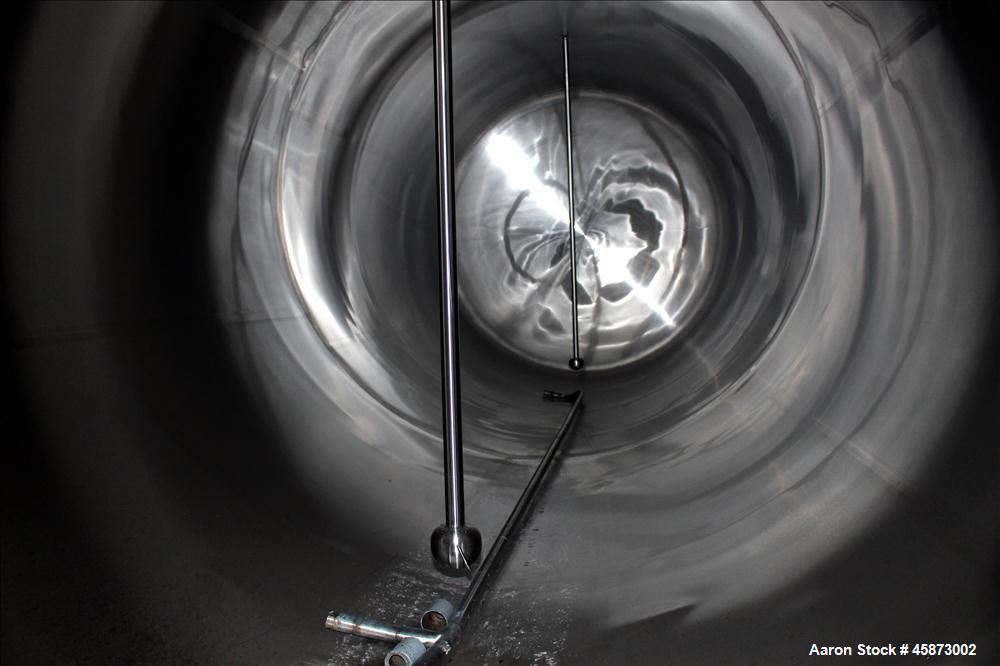 Used Walker Stainless Steel Equipment Co. Tank, Model 8480, 10,000 Gallon, 304 Stainless Steel, Horizontal. Approximately 100" diameter x 295" straight side. Dished Heads. (2) spray balls. 20" x 16" ...