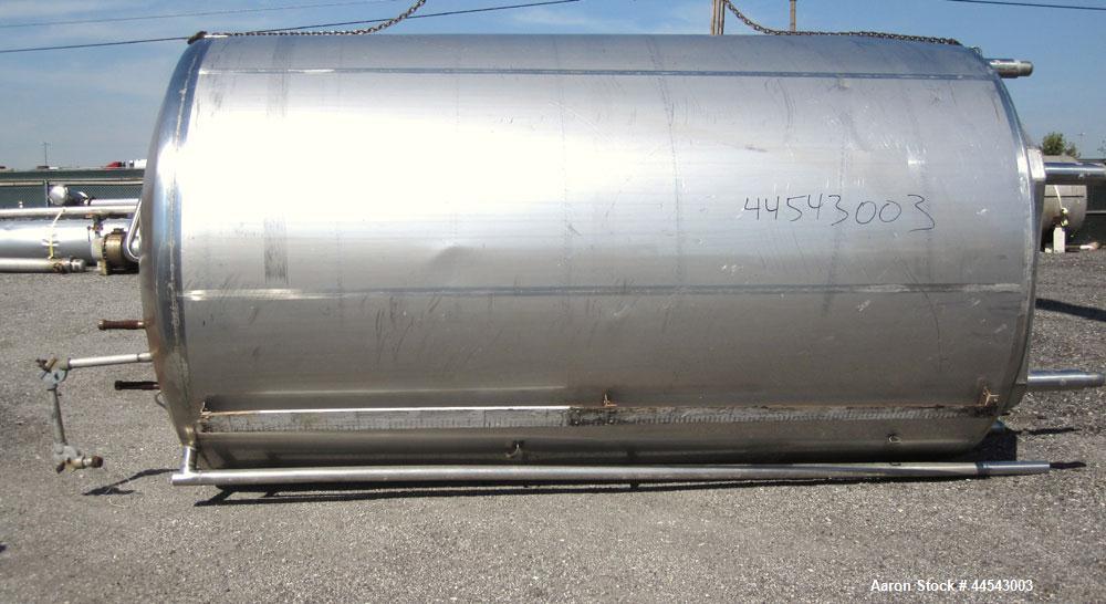 Used Walker Stainless Tank, 5000 Gallon, Model 9559, 304 Stainless Steel, Vertical. Approximately 96” diameter x 164” straight side, dished top, sloped bottom. Openings: top (2) 1-1/4” NPT, 2", 2" th...