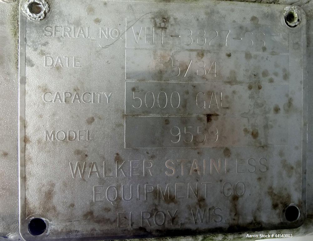Used Walker Stainless Tank, 5000 Gallon, Model 9559, 304 Stainless Steel, Vertical. Approximately 96” diameter x 164” straight side, dished top, sloped bottom. Openings: top (2) 1-1/4” NPT, 2", 2" th...