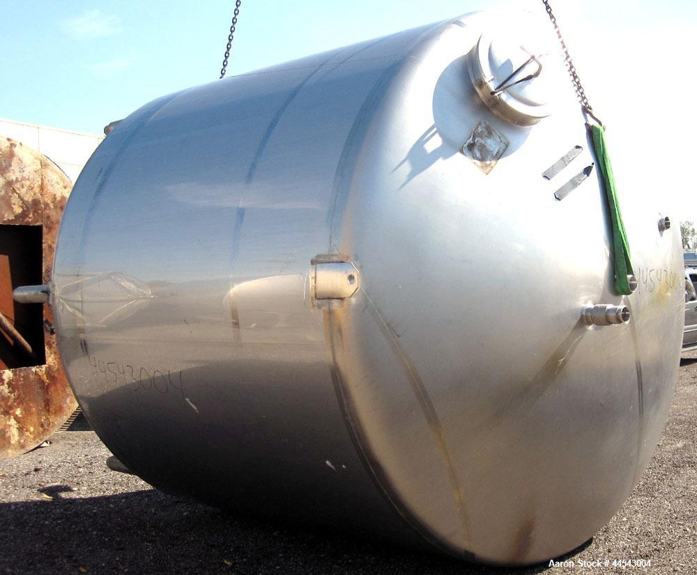 Used Walker Stainless Tank, 5000 Gallon, Model 9560, 304 Stainless Steel, Vertical. Approximate 120” diameter x 104” straight side, dished top, sloped bottom. Openings top (2) 3” NPT, 18” man way wit...