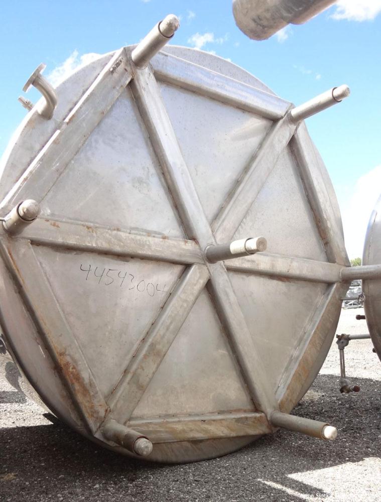Used Walker Stainless Tank, 5000 Gallon, Model 9560, 304 Stainless Steel, Vertical. Approximate 120” diameter x 104” straight side, dished top, sloped bottom. Openings top (2) 3” NPT, 18” man way wit...
