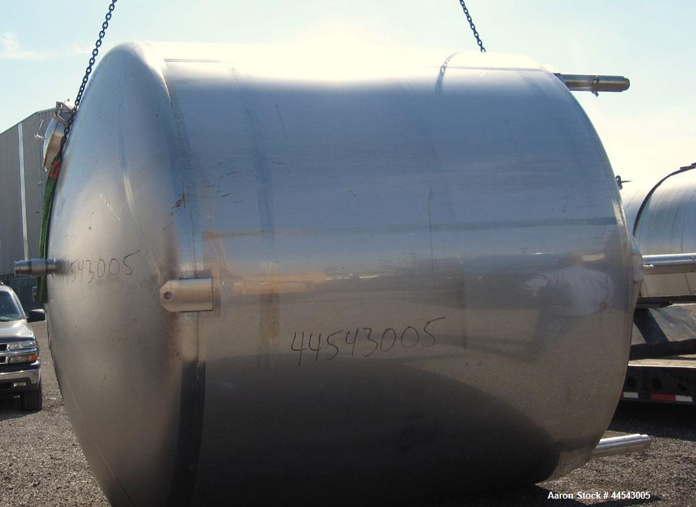 Used Walker Stainless Tank, 5000 Gallon, Model 9561, 304 Stainless Steel, Vertical. Approximate 120” diameter x 104” straight side, dished top, sloped bottom. Openings top (2) 3” NPT, 18” man way wit...