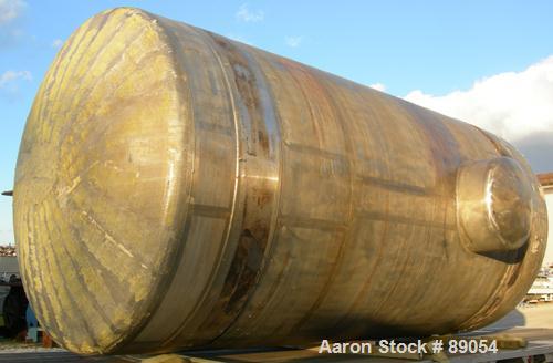USED: Walker Stainless tank, 8,500 gallon, 316 stainless steel, horizontal. Approximately 9' diameter x 16'9" straight side, dished ends. Internal rated 15 psi at 200 deg F. Openings: top 1", (3) 2",...