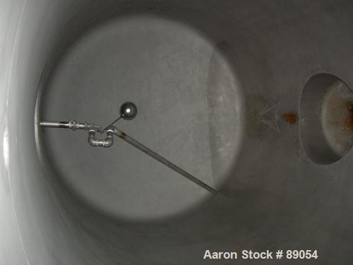 USED: Walker Stainless tank, 8,500 gallon, 316 stainless steel, horizontal. Approximately 9' diameter x 16'9" straight side, dished ends. Internal rated 15 psi at 200 deg F. Openings: top 1", (3) 2",...