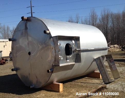 Used Walker, 5000 Gallon, Sanitary, Jacketed Mix Tank/Silo. Sweep mixer driven by Hydraulic Drive. 8'6" ID x 12' T/T. Dish Top and Convex bottom. 4" Outlet. Model SP-CWBT. Approximately 18'8" OAH. Un...
