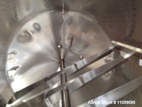 Used Walker, 5000 Gallon, Sanitary, Jacketed Mix Tank/Silo. Sweep mixer driven by Hydraulic Drive. 8'6" ID x 12' T/T. Dish Top and Convex bottom. 4" Outlet. Model SP-CWBT. Approximately 18'8" OAH. Un...