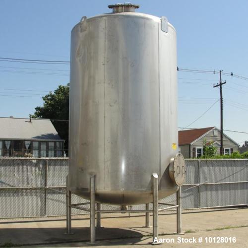 Used- Walker 5000 Gallon 304 stainless Steel Vertical Tank. This tank has a dome top and a dish bottom. The tank diameter is...