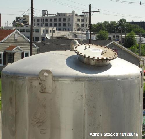 Used- Walker 5000 Gallon 304 stainless Steel Vertical Tank. This tank has a dome top and a dish bottom. The tank diameter is...