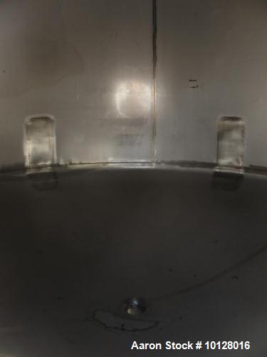 Used- Walker 5000 Gallon 304 stainless Steel Vertical Tank. This tank has a dome top and a dish bottom. The tank diameter is...