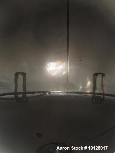 Used- Walker 5000 Gallon Vertical 304 Stainless Steel Tank. This tank has a dome top and a dish bottom. The tank diameter is...