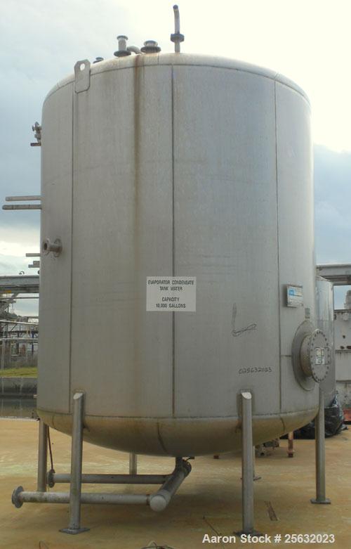 Used Walker Storage Tank, 10,000 Gallon, 304L stainless steel, vertical. Approximate 138" diameter x 144" straight side, dish top and bottom. Openings: top 3" vent, 18" manway; side 18" manway with c...