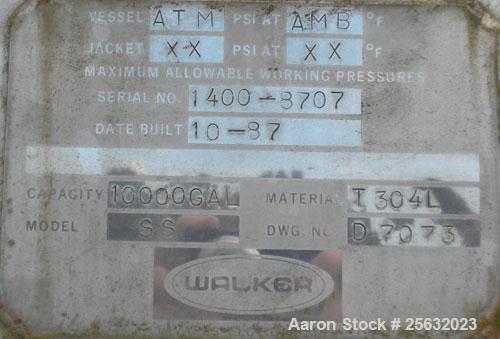 Used Walker Storage Tank, 10,000 Gallon, 304L stainless steel, vertical. Approximate 138" diameter x 144" straight side, dish top and bottom. Openings: top 3" vent, 18" manway; side 18" manway with c...