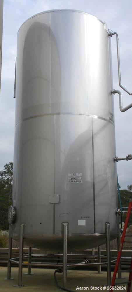 Used Walker Storage Tank, Model SS, 21,000 gallon, 304L stainless steel, vertical. Approximate 12' diameter x 24' straight side, dish top and bottom. Top openings include an 18" manway with bolt-on c...