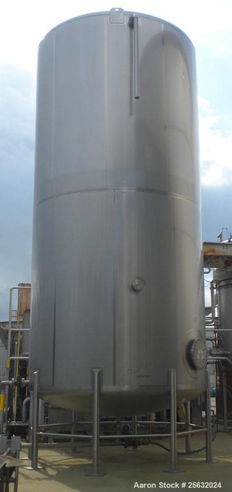 Used Walker Storage Tank, Model SS, 21,000 gallon, 304L stainless steel, vertical. Approximate 12' diameter x 24' straight side, dish top and bottom. Top openings include an 18" manway with bolt-on c...