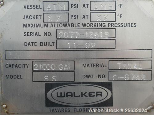 Used Walker Storage Tank, Model SS, 21,000 gallon, 304L stainless steel, vertical. Approximate 12' diameter x 24' straight side, dish top and bottom. Top openings include an 18" manway with bolt-on c...