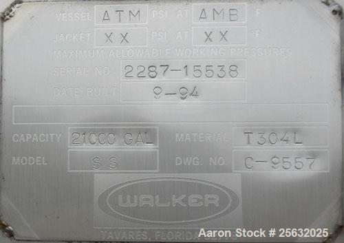 Used Walker Storage Tank, Model SS, 21,000 gallon, 304L stainless steel, vertical. Approximate 12' diameter x 24' straight side, dish top and bottom. Top openings include an 18" manway with bolt-on c...