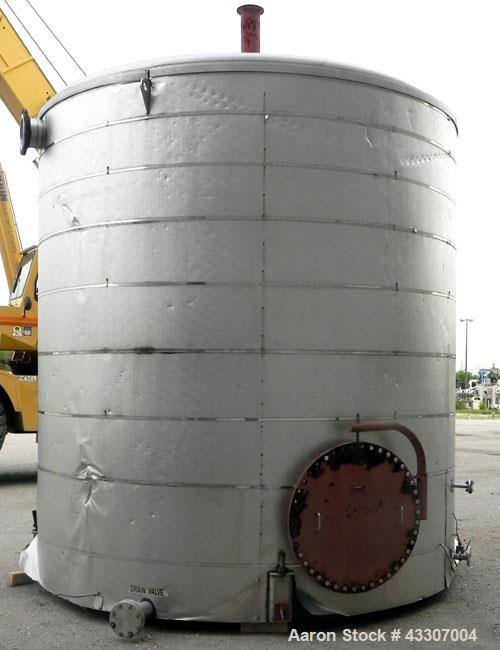 Used Walker Stainless Tank, 8500 Gallon, 304 Stainless Steel, Vertical. Approximate 132” diameter x 144” straight side, coned top, flat bottom. Top entering disperser, approximate 1-1/2” diameter x 8...