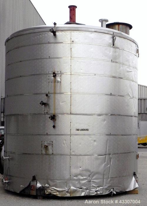 Used Walker Stainless Tank, 8500 Gallon, 304 Stainless Steel, Vertical. Approximate 132” diameter x 144” straight side, coned top, flat bottom. Top entering disperser, approximate 1-1/2” diameter x 8...