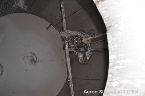Used Walker Stainless Tank, 8500 Gallon, 304 Stainless Steel, Vertical. Approximate 132” diameter x 144” straight side, coned top, flat bottom. Top entering disperser, approximate 1-1/2” diameter x 8...