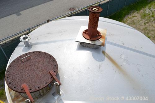 Used Walker Stainless Tank, 8500 Gallon, 304 Stainless Steel, Vertical. Approximate 132” diameter x 144” straight side, coned top, flat bottom. Top entering disperser, approximate 1-1/2” diameter x 8...