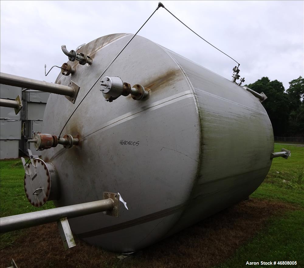 Used Walker Stainless Tank, 7500 Gallon, 304L Stainless Steel, Vertical. 132" Diameter x 144" straight side, dished top and bottom. Openings top 1", 2", (2) 3", 24" man way. Side (3) 1", 3", side bot...