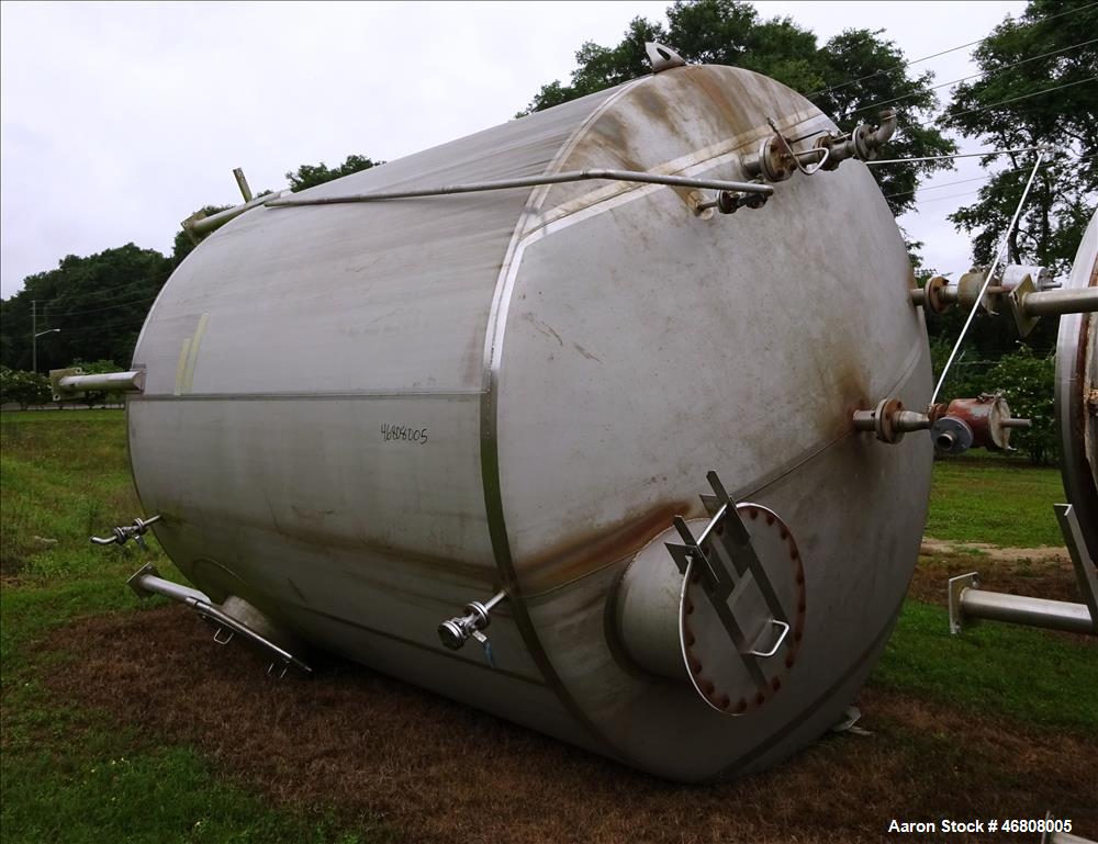 Used Walker Stainless Tank, 7500 Gallon, 304L Stainless Steel, Vertical. 132" Diameter x 144" straight side, dished top and bottom. Openings top 1", 2", (2) 3", 24" man way. Side (3) 1", 3", side bot...