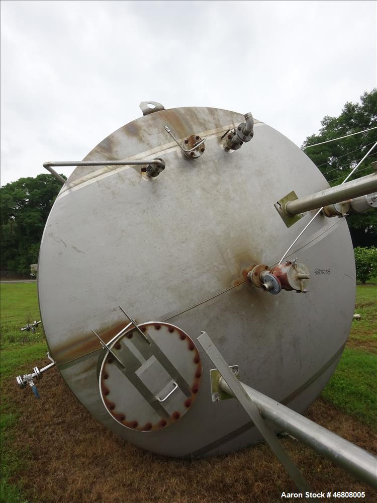 Used Walker Stainless Tank, 7500 Gallon, 304L Stainless Steel, Vertical. 132" Diameter x 144" straight side, dished top and bottom. Openings top 1", 2", (2) 3", 24" man way. Side (3) 1", 3", side bot...