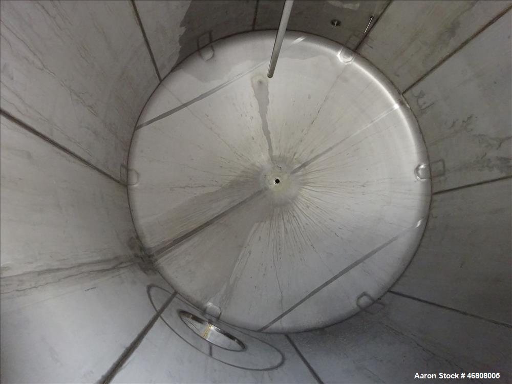 Used Walker Stainless Tank, 7500 Gallon, 304L Stainless Steel, Vertical. 132" Diameter x 144" straight side, dished top and bottom. Openings top 1", 2", (2) 3", 24" man way. Side (3) 1", 3", side bot...