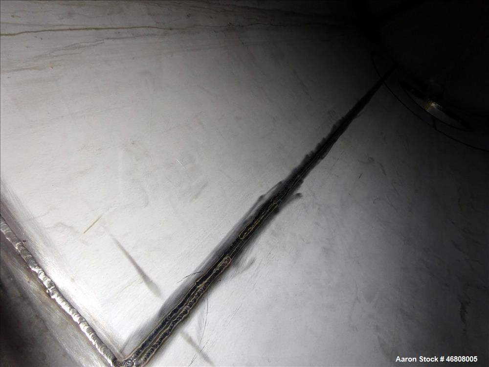 Used Walker Stainless Tank, 7500 Gallon, 304L Stainless Steel, Vertical. 132" Diameter x 144" straight side, dished top and bottom. Openings top 1", 2", (2) 3", 24" man way. Side (3) 1", 3", side bot...