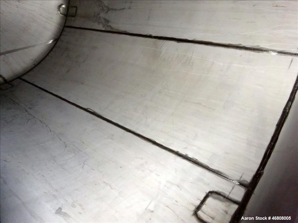 Used Walker Stainless Tank, 7500 Gallon, 304L Stainless Steel, Vertical. 132" Diameter x 144" straight side, dished top and bottom. Openings top 1", 2", (2) 3", 24" man way. Side (3) 1", 3", side bot...