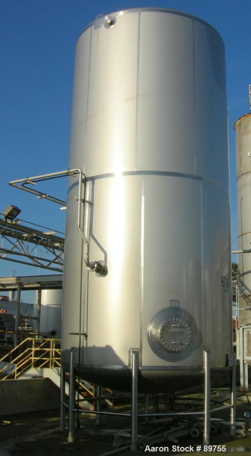 USED: Walker 21,000 gallon, type 304L stainless steel, storage tank. Vertical, dished heads, approximate 12' diameter x 24' straight side. Top openings include an 18" manway with bolt-on cover, 2" fl...
