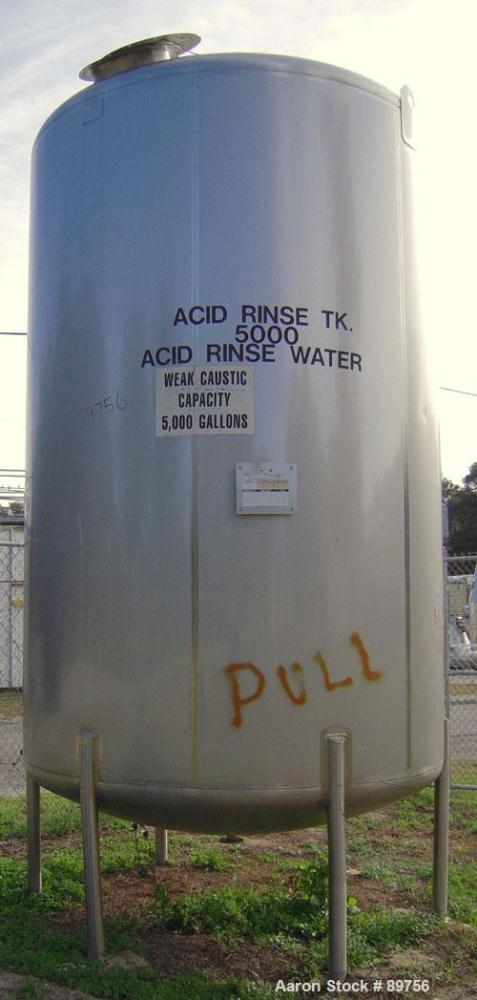USED: Walker 5,000 gallon, type 304L stainless steel, storage tank. Vertical, dished heads. Approximate 8' diameter x 12' straight side. Misc top and side flanged openings. Bottom has a 2" center out...