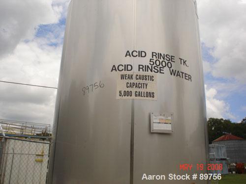 USED: Walker 5,000 gallon, type 304L stainless steel, storage tank. Vertical, dished heads. Approximate 8' diameter x 12' straight side. Misc top and side flanged openings. Bottom has a 2" center out...